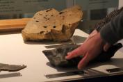 Catch a Shooting Star exhibit - meteorite and impact rock touch table at Manchester Museum. Image: M. Nottingham