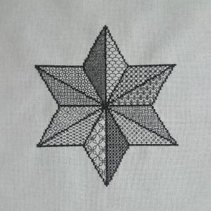 A star, with different textures and patterns using black thread on a white background.
