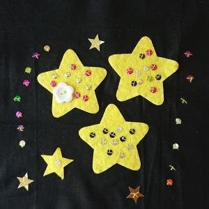 Stars in various sizes on a black background.
