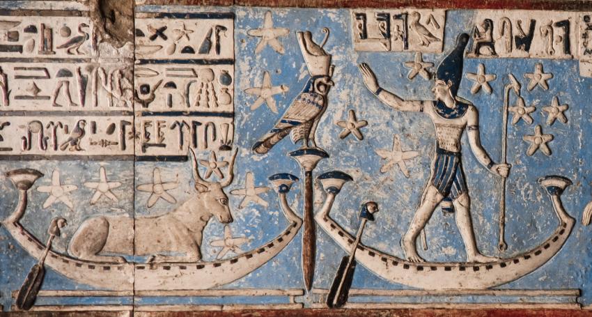 Detail from an astronomical ceiling in the temple of Dendera, depicting stars in the area of Orion (a male figure) and Sirius (a cow) sailing the sky in barques.
