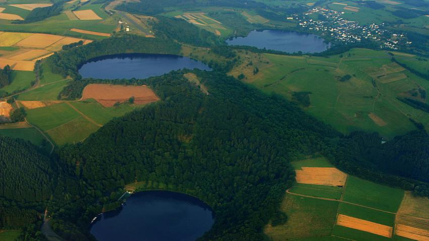 Aerial photograph of three water-filled maars in the Eifel, Germany 