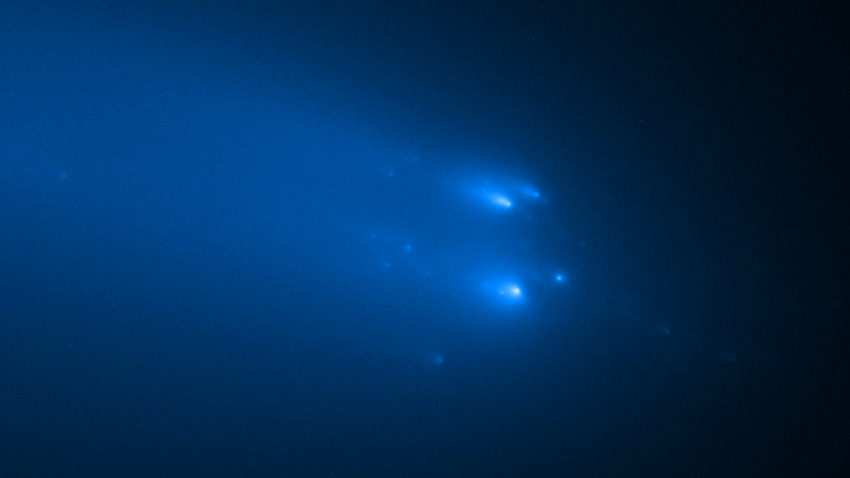 Image showing blue fragments of a comet breaking up