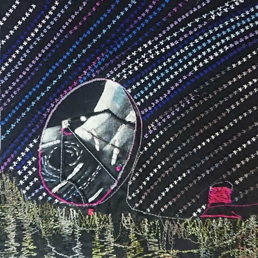 Embroidered observatory and star trails.