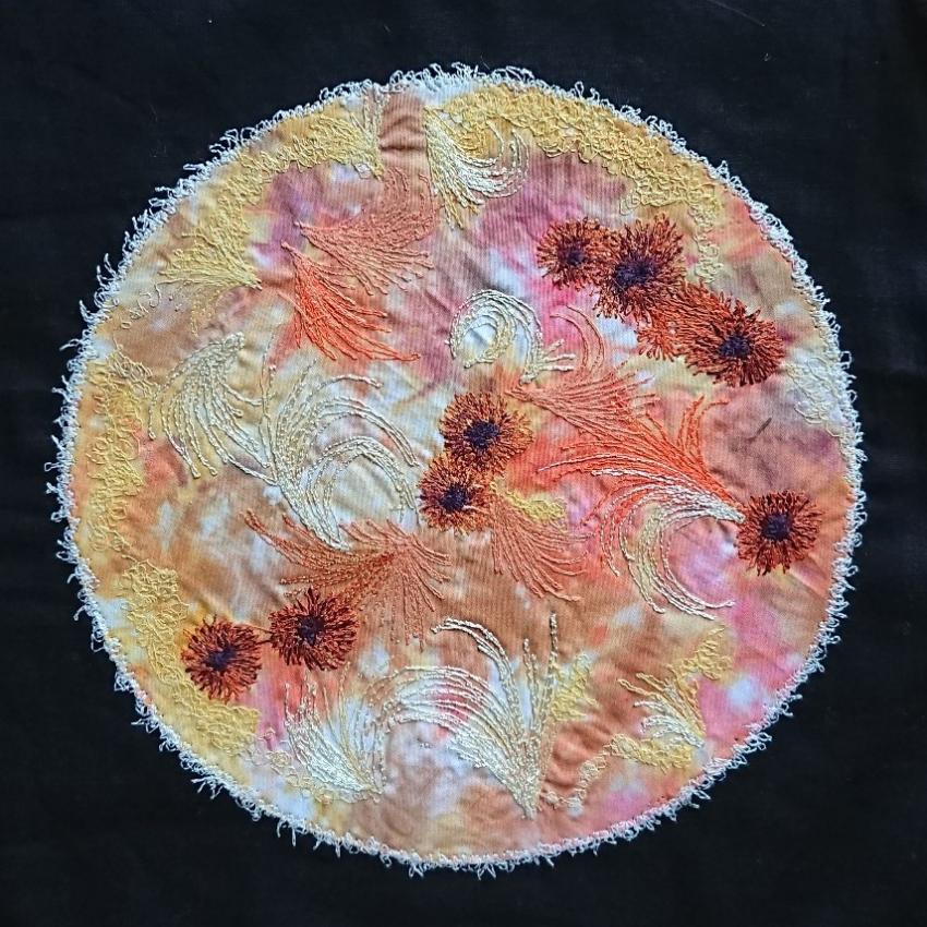 The Sun embroidered, featuring sun spots and solar flares