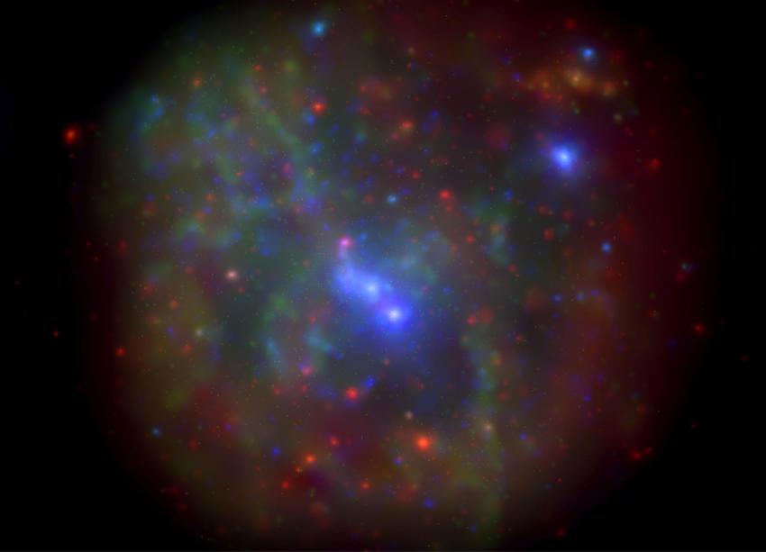 Multicoloured filaments in space surrounding a bright blue core, Sagittarius A*. The filaments appear to be red, and green, and look gaseous.