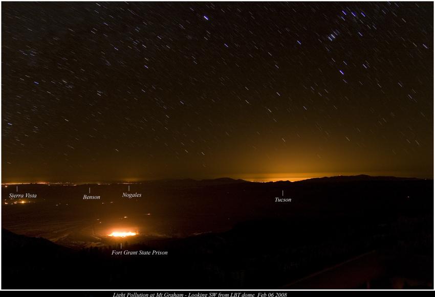 An image of the skyline seen from a high altitude. The areas of Tucson, Nogales, Benson, and Sierra Vista are labelled on the horizon. Each area has a glow emanating from it, indicating the light pollution coming from there.