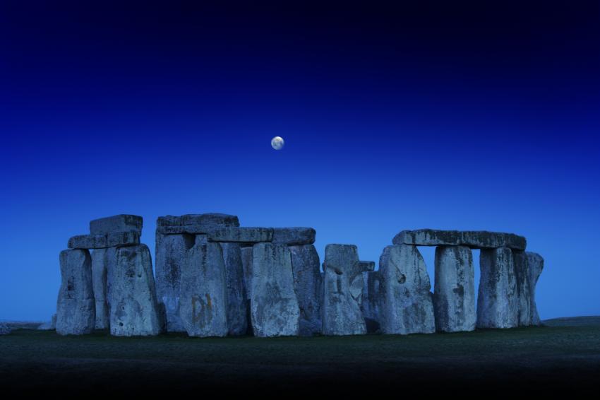 Stonehenge with the Moon above it.