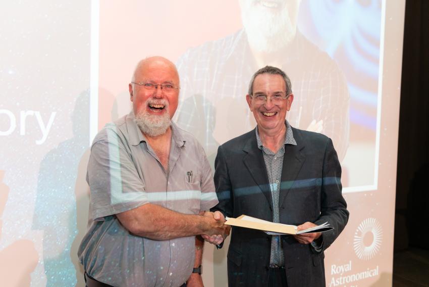 Dr Ian McCrea, of Rutherford Appleton Laboratory, receives his Service Award (G) from RAS President Mike Lockwood.