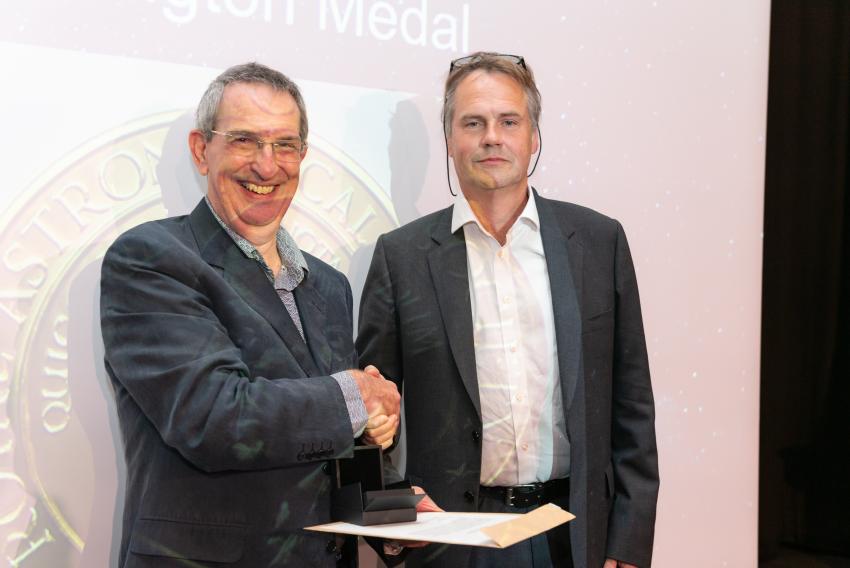 Professor Pedro Ferreira, of the University of Oxford, is presented with the Eddington Medal (A) by RAS President Mike Lockwood.