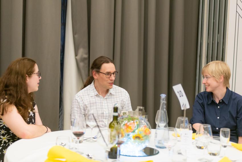 NAM 2024 organisers Dr David Benoit (centre) and Dr Elke Roediger (right), of the University of Hull, at the RAS awards dinner.