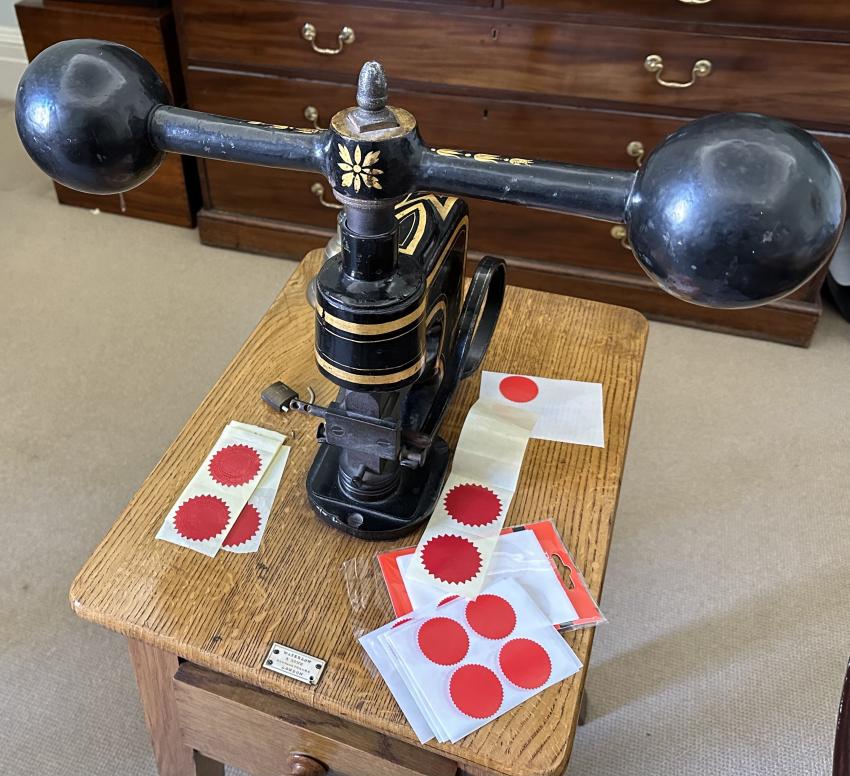 The 19th Century seal press used in the signing of the lease documents.