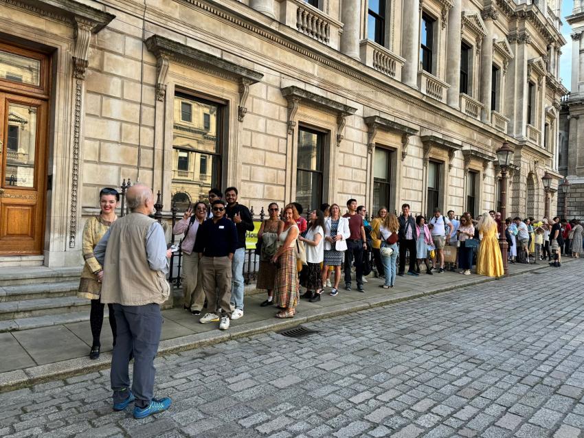 People queue outside the Royal Astronomical Society's offices.