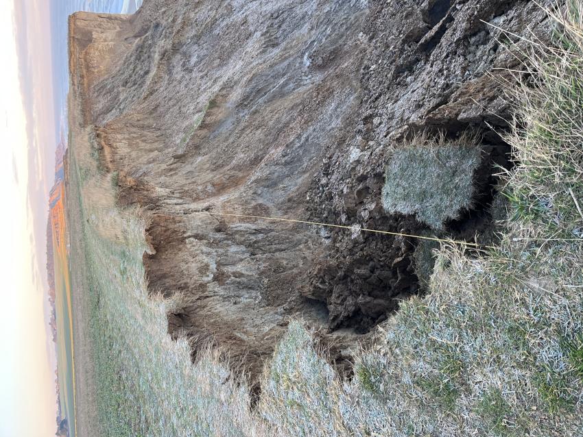 exposed cliff due to collapse.