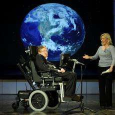 Stephen Hawking being presented by his daughter Lucy Hawking at the lecture he gave for NASA's 50th anniversary