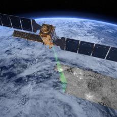 Digital rendering of the Sentinel-1 satellite in orbit, projecting a radar beam onto the Earth.