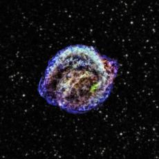 Image of a supernova remnant, with different areas of gas and dust highlighted in different colours