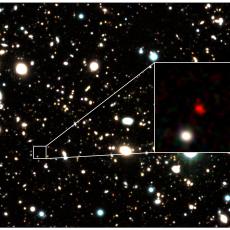The galaxy HD1, a red object, appears at the centre of a zoom-in image.