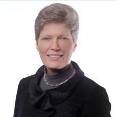 Image of Prof. Dr Eva Grebel smiling against a white background.