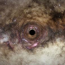 An image of the Milky Way warped around a small black circle at the centre of the image.