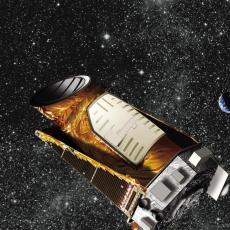 An artist's concept of the Kepler Space Telescope in space. The telescope is roughly cylindrical in shape, made of rust and silver coloured materials. Many stars can be seen in the background, as well as the Sun and Earth-Moon system.