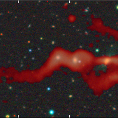 RAD-BAARG radio galaxy, with the 144 MHz radio image from the LOFAR radio telescope shown in red and the optical image from the BASS survey shown in RGB colour. 