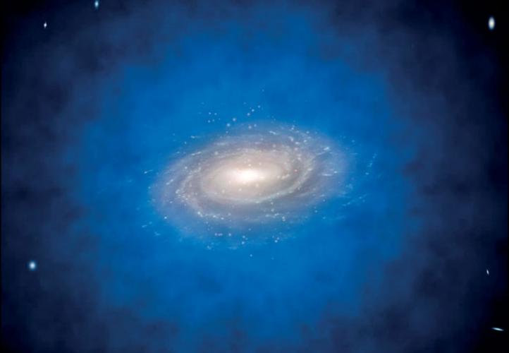Image of a spiral galaxy surrounded by a blue cloud representing the dark matter halo