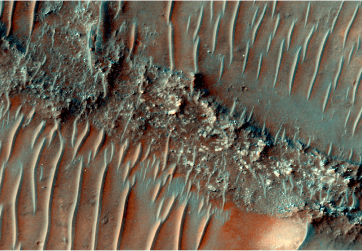 Colour image of a flat top, heavily eroded FSR. Sand dunes can be seen migrating over the top of the FSR. 