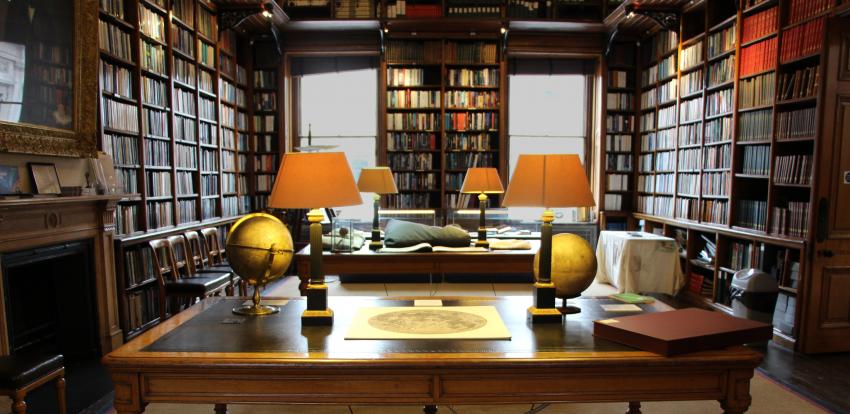 Library of the Royal Astronomical Society, with Moon globes by Russell and a map of the Moon by Cassini on display.
