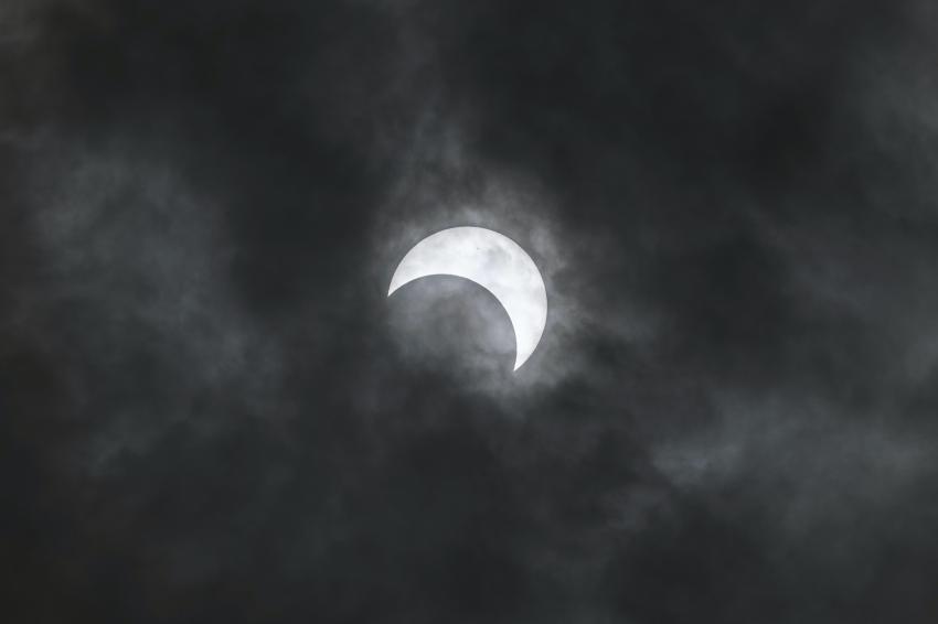 An annular eclipse with the Moon taking out part of the Sun. 