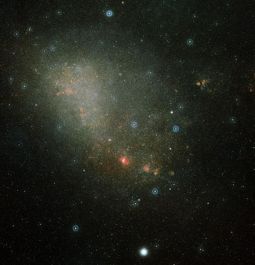 Image of the Magellanic Cloud, a faint loosely bound galaxy in light blue colours.