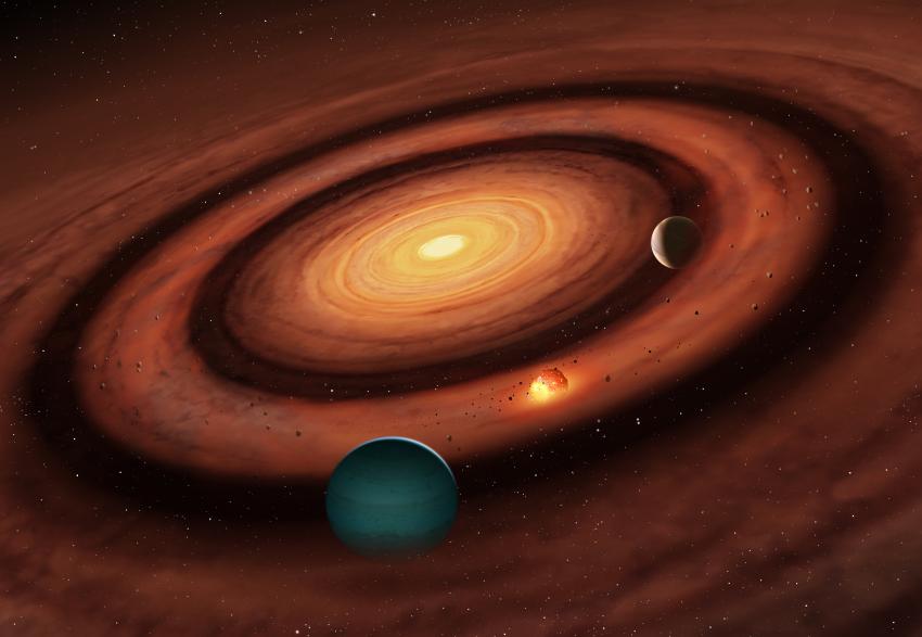 An artist's impression of a planetary system appearing in colours of orange, yellow and brown.