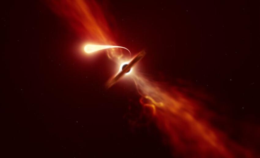 The artist's impression shows a star being consumed by a black hole. The black hole appears red and black and glows with a red light. The star in the foreground is orange in colour and also glows.